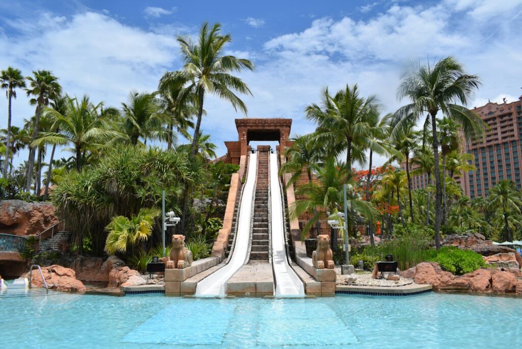 Experience thrilling leisure at Atlantis waterpark, Bahamas with lush tropical scenery.